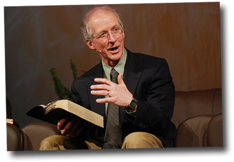John Piper with Bible