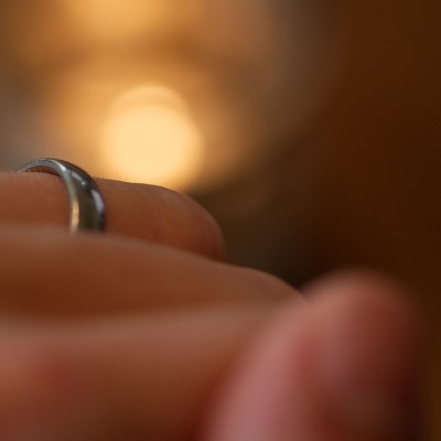 close up of wedding ring on finger