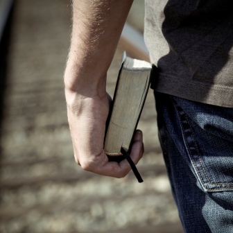 man holding bible