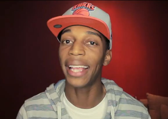man with knicks hat on