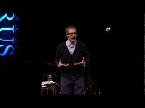 man presenting on stage