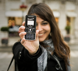 girl holding up phone