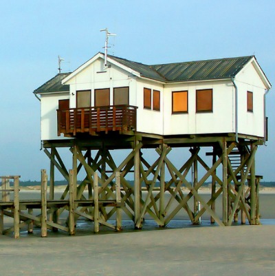 house on stilts on beach