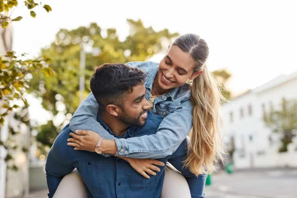 A happy couple enjoying the outdoors.