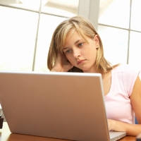 girl looking at computer