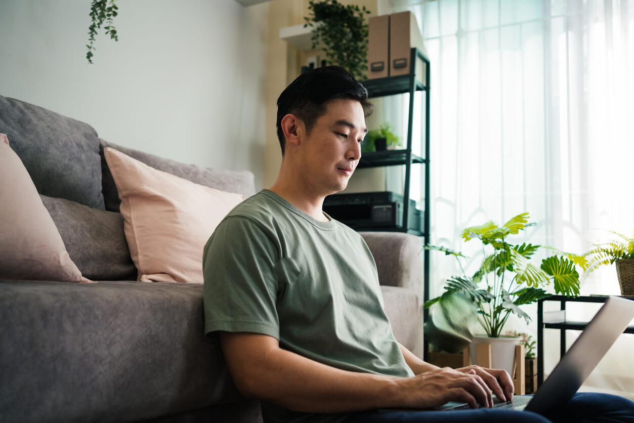 A man on his computer, surfing for God.