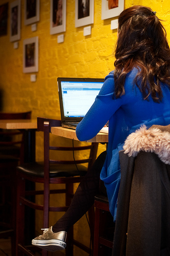 girl on laptop at coffee shop