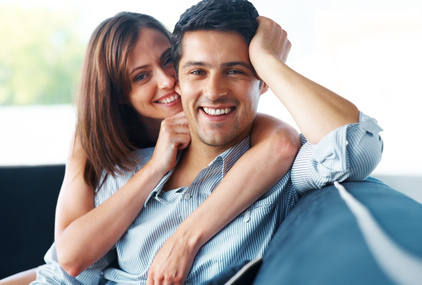 couple smiling on couch