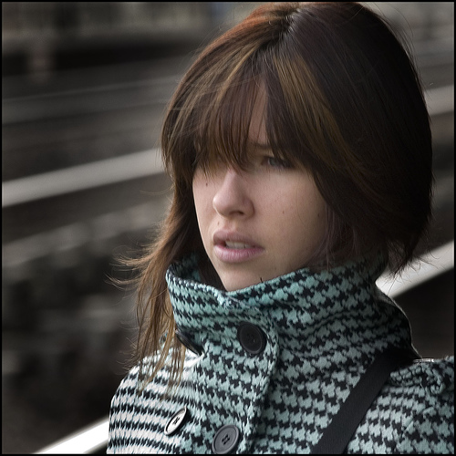 sad woman walking on street