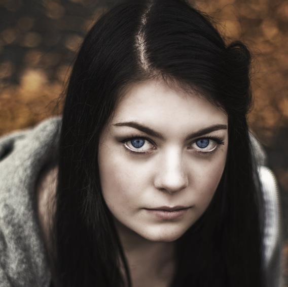 blue eyed woman looking at camera