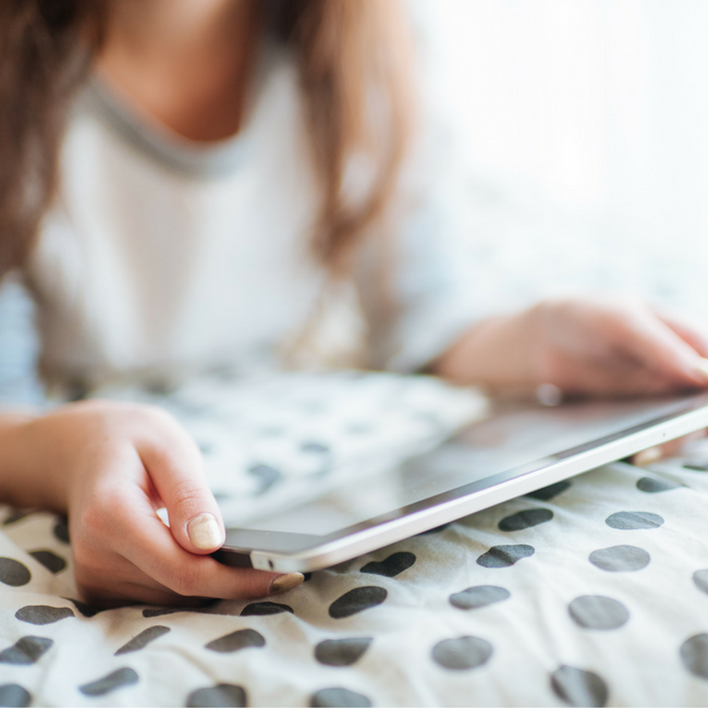 young girl on tablet