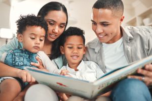 Parents reading The Birds and the Bees to their young children.