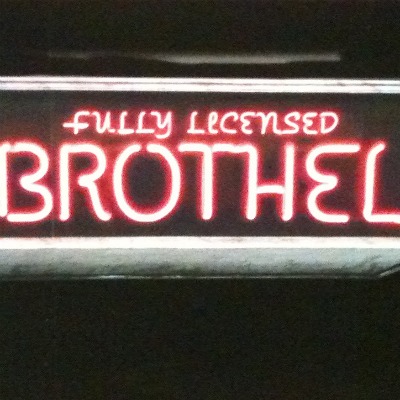 fully licensed brothel sign