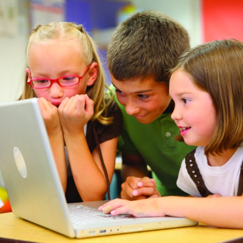 three kids on laptop