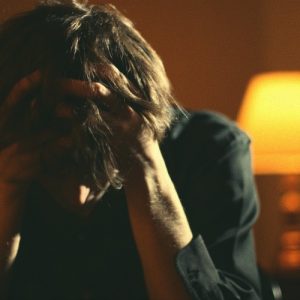 frustrated man with head in hands