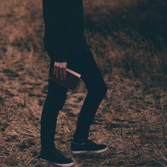 man walking with bible