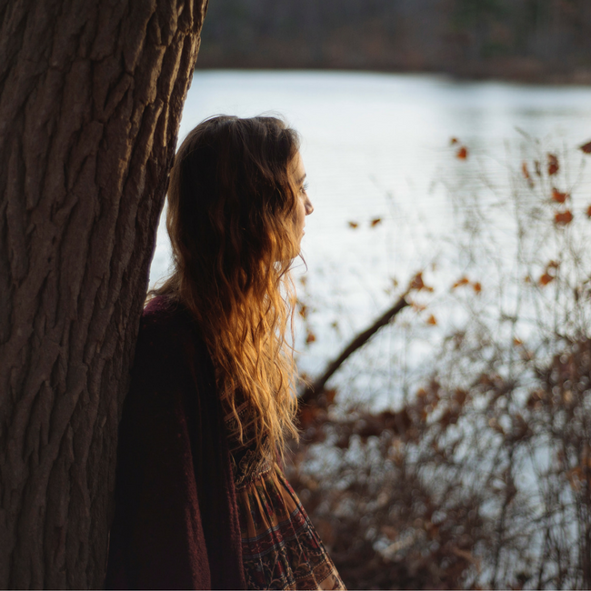 teen girl looking at lake
