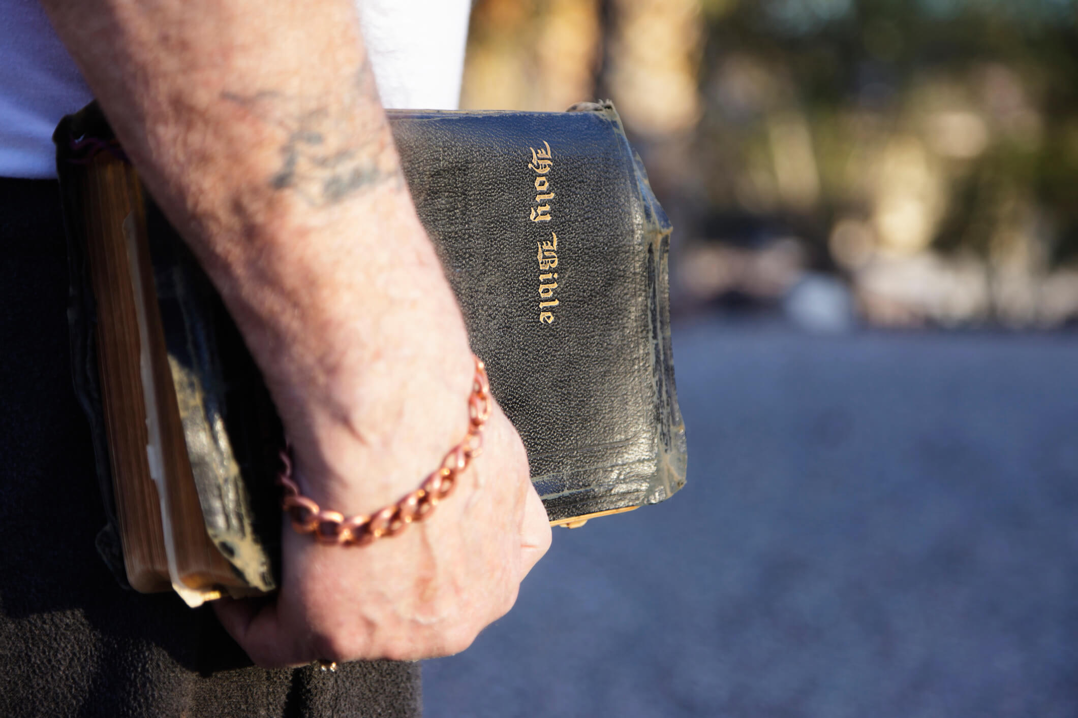 A man holding a Bible and walking in the spirit.