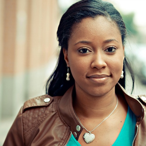 woman smiling and alone outside