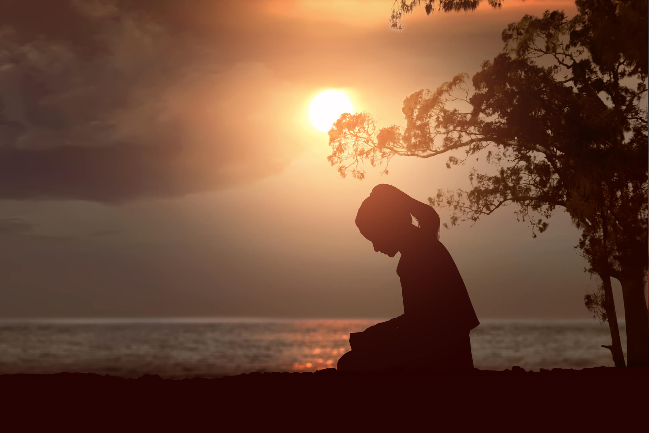 A young woman praying to be free from porn.