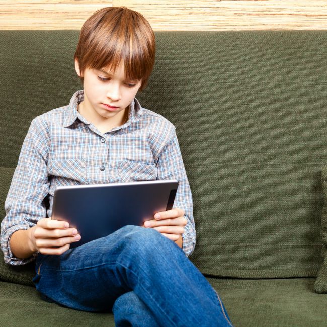 young boy on tablet