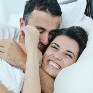 couple snuggling in bed