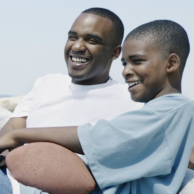 dad and son with football