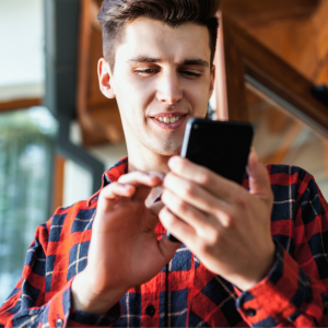 young man looking at phone