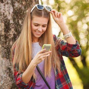 teen girl looking on phone