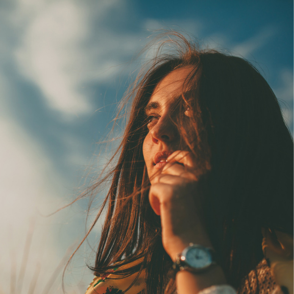 woman looking into sky