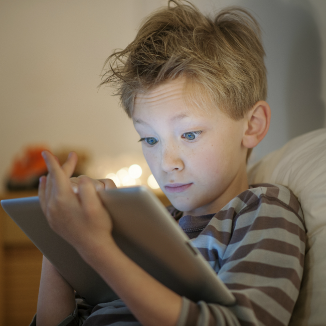 young boy on tablet
