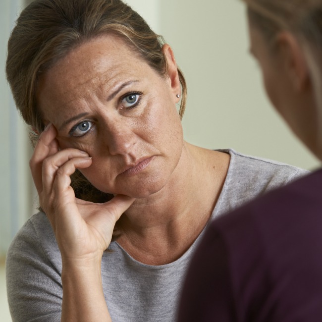 distressed woman talking with friend