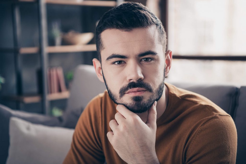 Man who has just relapsed into porn looking thoughtful.