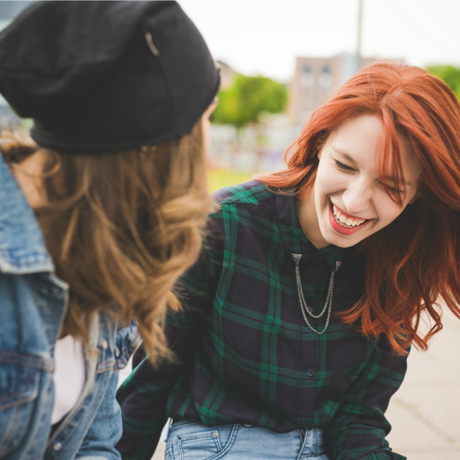 two girl friends laughing