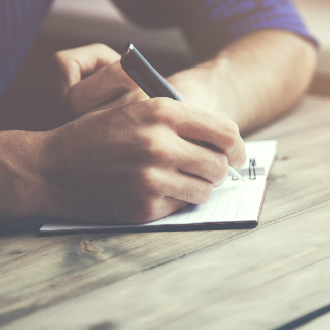 husband writing in journal