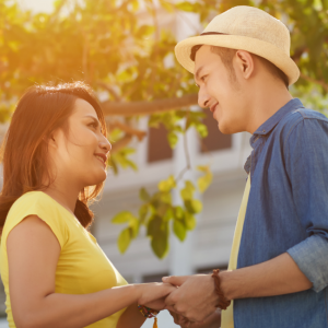 couple looking at each other holding hands