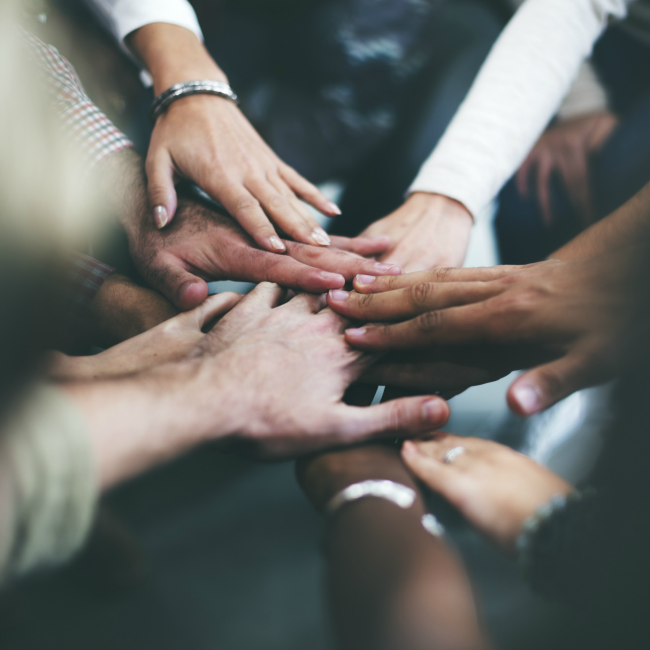 hands piled together