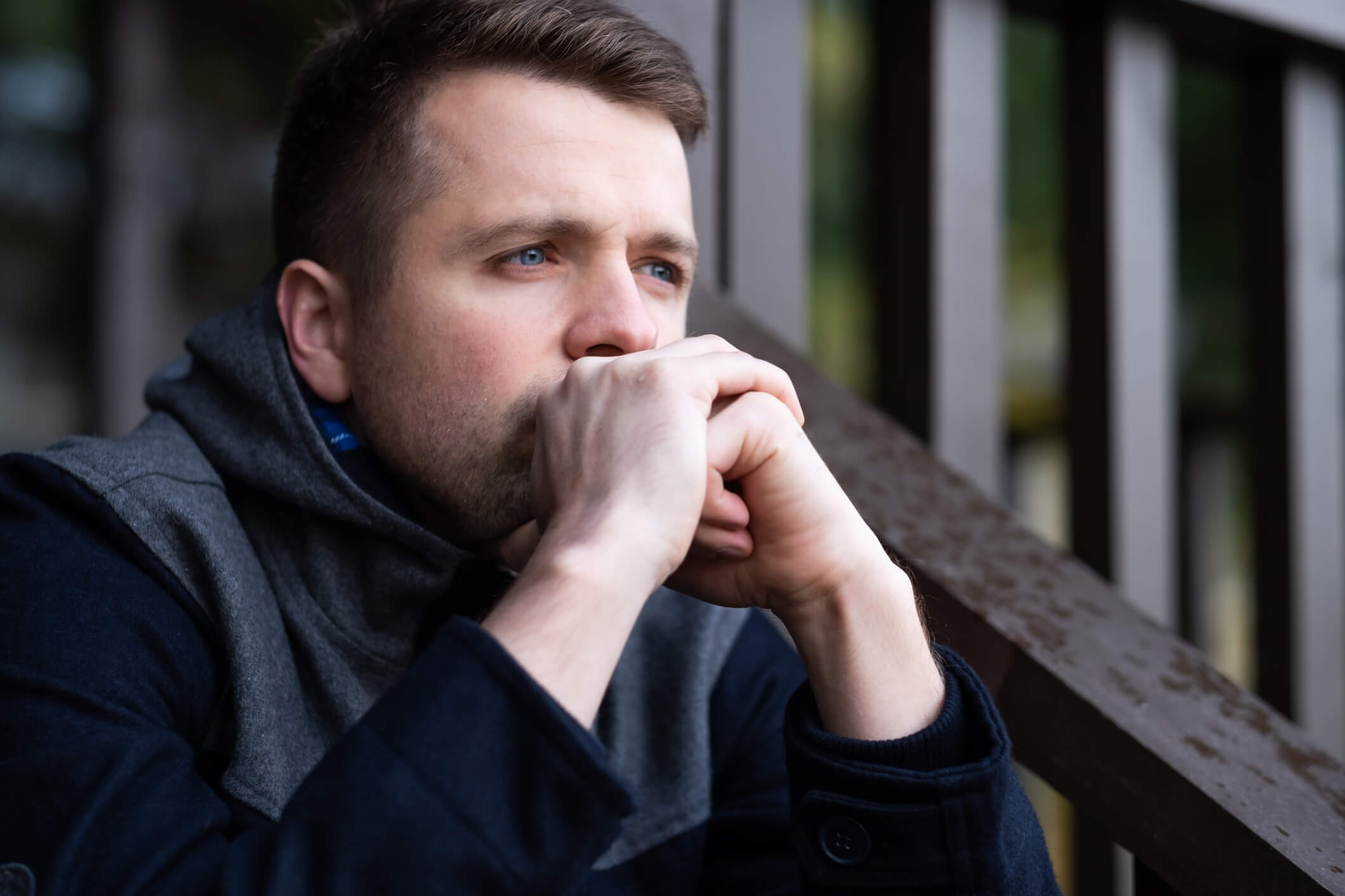 Thoughtful young man wondering if he is addicted to sex.