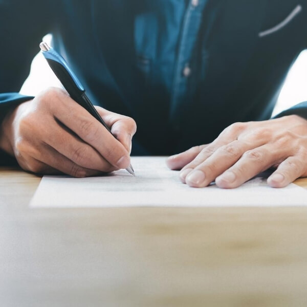 man writing letter