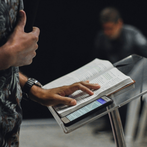 man preaching at podium