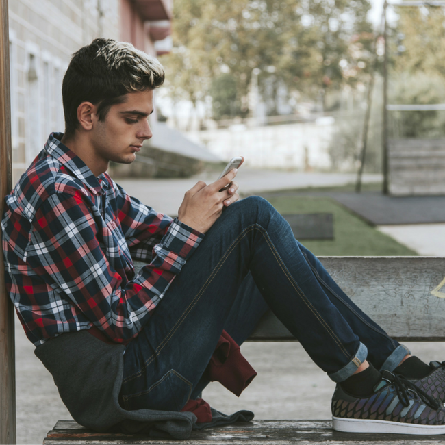 teenage boy on cell phone