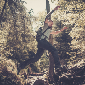 man jumping in woods