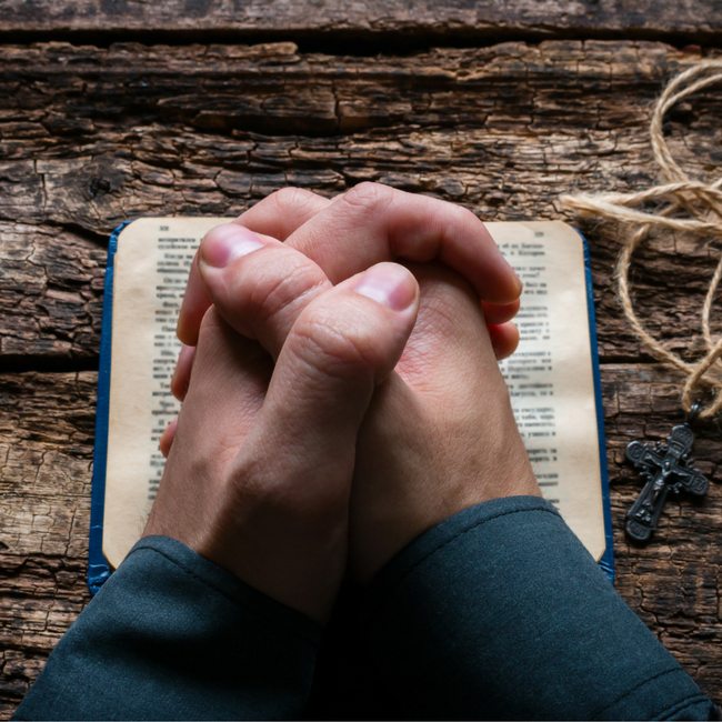 praying hands with cross