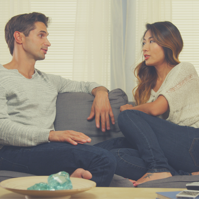 couple talking on couch