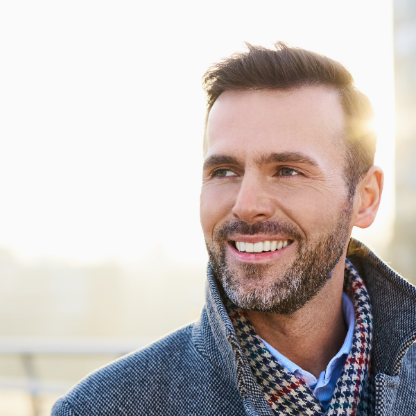 hopeful man walking through city