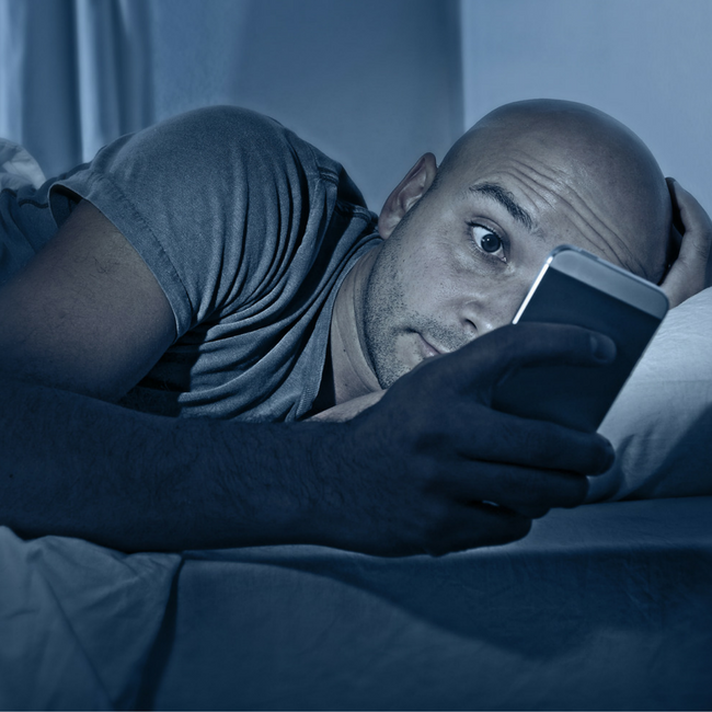 man on mobile phone at night
