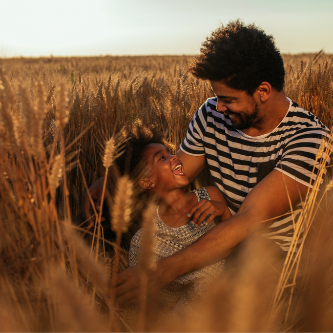 dad and daughter laughing together