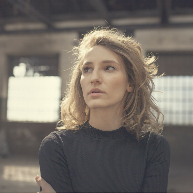 young woman looking off into distance