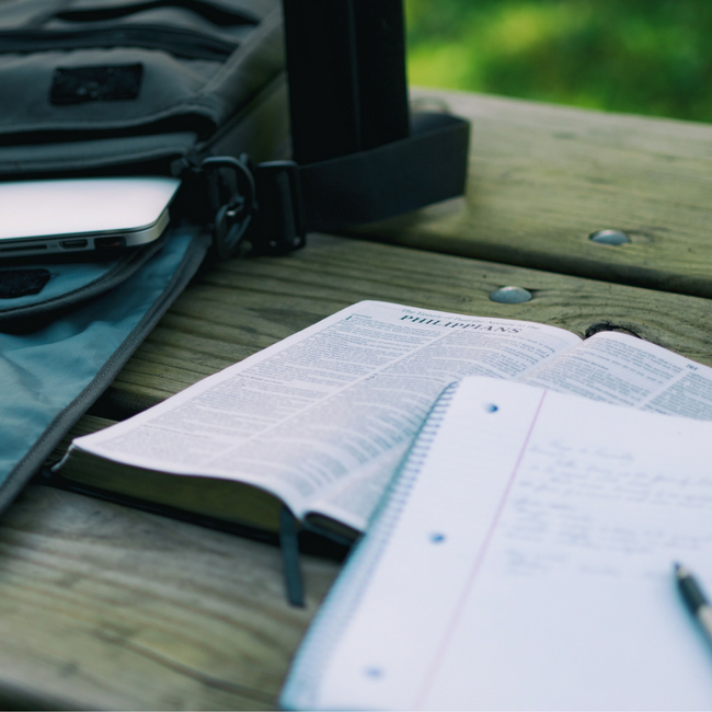 bible notebook and computer