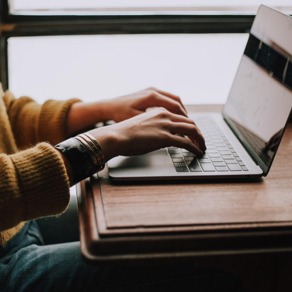 girl on laptop at coffee shop